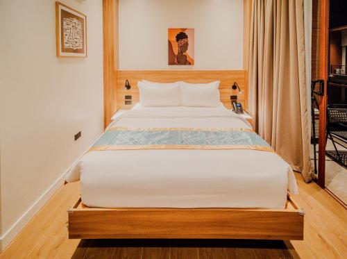 Ένα ή περισσότερα κρεβάτια σε δωμάτιο στο Grand Palm Villas & Hotel