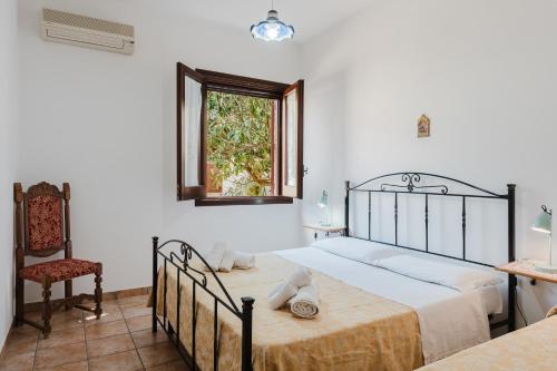 Ένα ή περισσότερα κρεβάτια σε δωμάτιο στο Baglio Montoleone