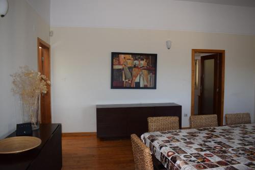 a bedroom with a bed and a table and chairs at Douro Natura in Bemposta