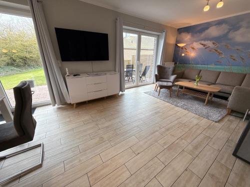 Bauernhof Claussen Fehmarnにあるテレビまたはエンターテインメントセンター