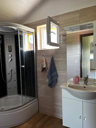 a bathroom with a shower and a sink at PontyParádé in Fonyód