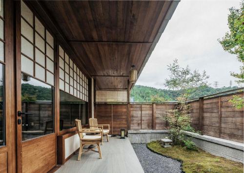 a view from the balcony of a house with a table and chairs at Jingdezhen Xingshan City outside Jielu Hotel in Jingdezhen