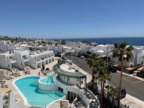 an aerial view of a resort with a swimming pool at Kikere Studios in Puerto del Carmen
