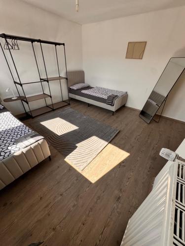 a room with two bunk beds and wooden floors at A&V Apartments Iserlohn Kiki Karl-Arnold in Iserlohn