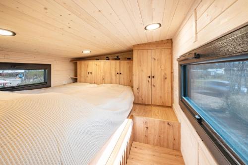 Postel nebo postele na pokoji v ubytování Tiny House Ingo John