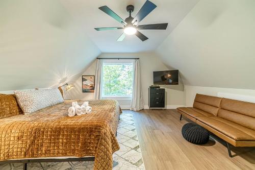 a bedroom with a bed and a ceiling fan at Lovely Secluded Cabin Surrounded by Trees in Clarkesville, Georgia in Aerial
