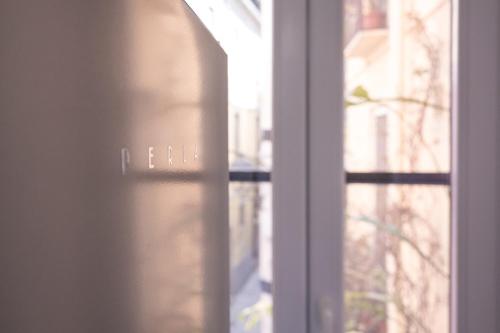 a window with a view of a building at Casa Glow Isernia - privacy, wi-fi, colazione in Isernia