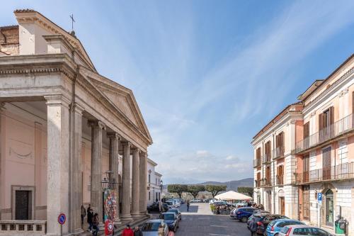 a city street with parked cars and buildings at Casa Glow Isernia - privacy, wi-fi, colazione in Isernia