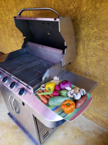 an open container of food on a grill at Casa Colonial Cozumel, Villa Mango in Cozumel