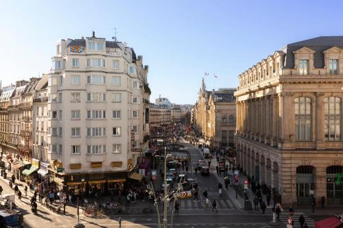 a view of a busy city street with buildings at Hôtel Hor Europe in Paris