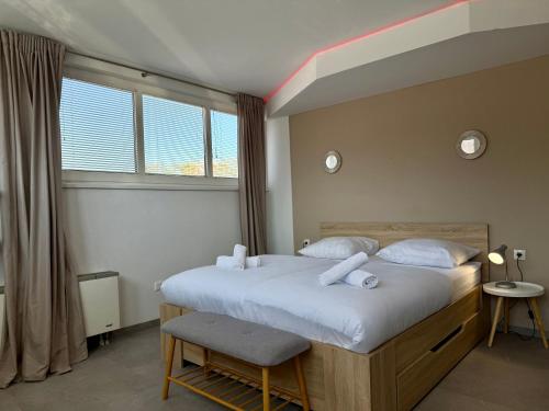 Katil atau katil-katil dalam bilik di Apartments Park Šiška Ljubljana