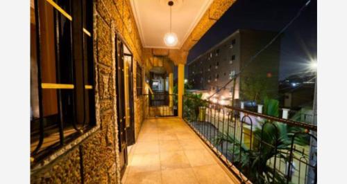 an empty balcony of a building at night at Beauty home Douala ndogbong in Douala