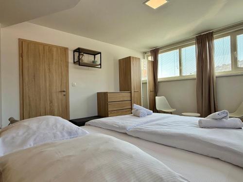 Katil atau katil-katil dalam bilik di Apartments Park Šiška Ljubljana
