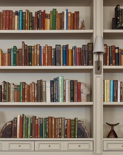 a book shelf filled with lots of books at Miiro Templeton Garden in London