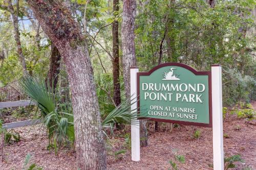 a sign for a drummond point park in the woods at 2349 Courtside Villas in Amelia Island