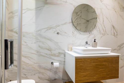 a bathroom with a sink and a mirror on the wall at Spiros country home in Áno Korakiána