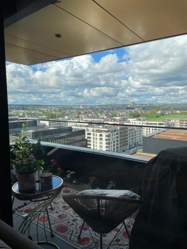a balcony with a view of a city at Elegant Escape Pool & Sauna in Luxembourg