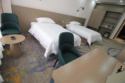 Cama o camas de una habitación en Carrey Hotel