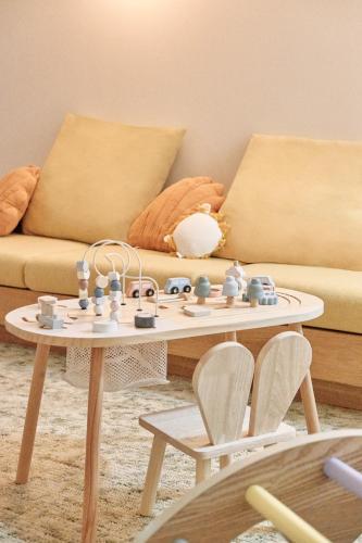 a living room with a coffee table and a couch at Elysée Montmartre Hotel in Paris