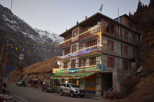 a building on the side of a mountain at SALCHAN INN Home Stay in Takh