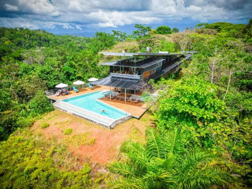 an aerial view of a house with a swimming pool at Cielo Lodge in Golfito