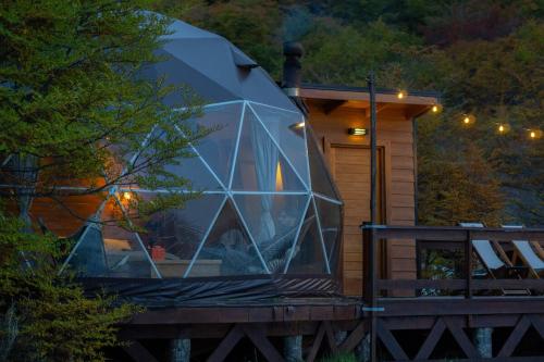 a large glass dome on the front of a cabin at DOMO en Ushuaia Glamping in Ushuaia