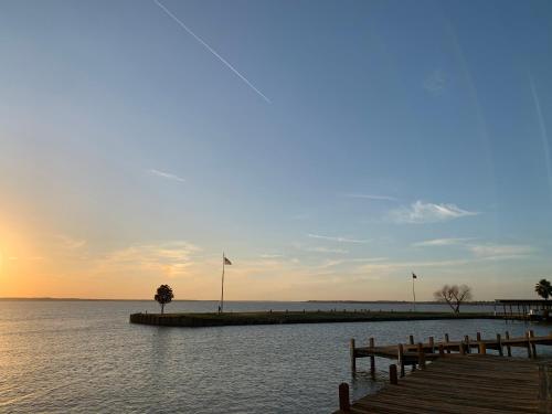 a dock in the water with flags on it at On The Lake #114 in Onalaska