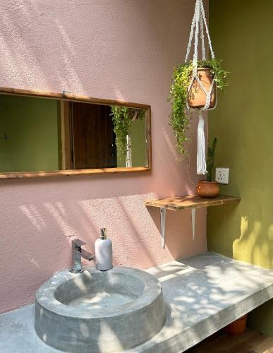 a bathroom with a sink and a mirror at Villa Arugam Bay in Arugam Bay