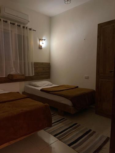 Postel nebo postele na pokoji v ubytování Anne 2 dahab