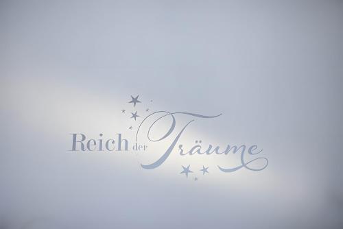 a white stars and a ribbon with the words rich for karma at Charmingsuite in Bad Teinach-Zavelstein