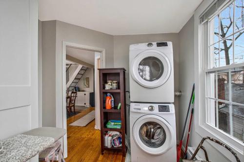 a laundry room with a washing machine and a washer at Charming Beach House Top Floor - Walk Everywhere in North Beach