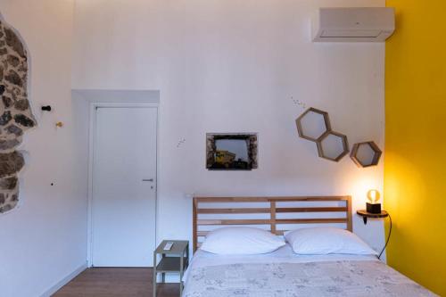 Ένα ή περισσότερα κρεβάτια σε δωμάτιο στο Casa Vacanze Callegari