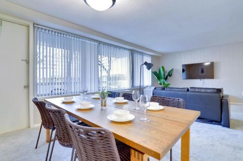 a dining room with a wooden table and chairs at This Apt is Perfect For Business Trips or a Relaxing Vacation in Arlington