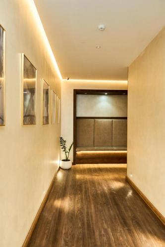 a large room with a large window and a potted plant at EDEM Hotel in Türkistan