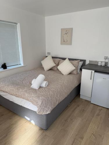 Ένα ή περισσότερα κρεβάτια σε δωμάτιο στο Colne cabin