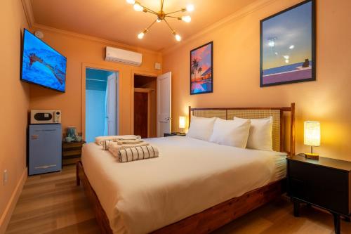 a bedroom with a large bed in a room at Monaco Vacation Rentals in Clearwater Beach