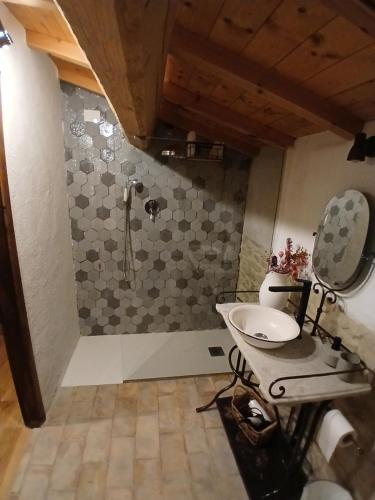 a bathroom with a shower with a sink and a toilet at Casale Regnano in Città di Castello