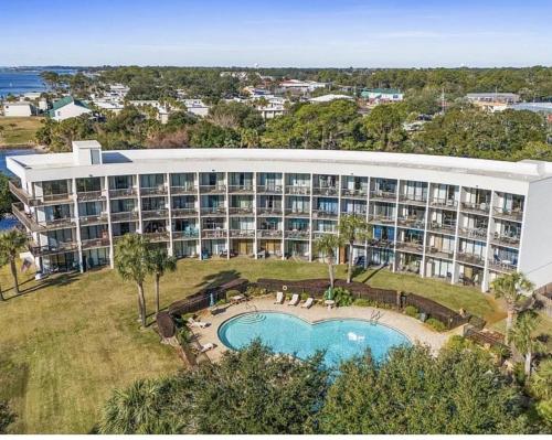 an aerial view of a resort with a swimming pool at Pirates Bay B315 - Bayfront Beauty in Fort Walton Beach