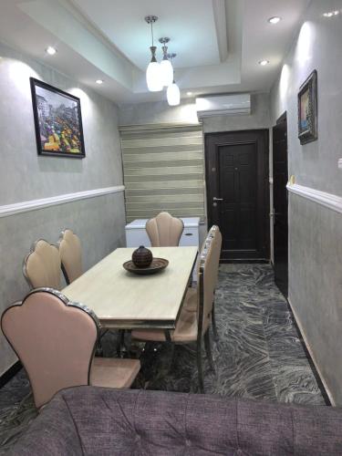 a dining room with a table and chairs at 2 bed room apartment in Lekki