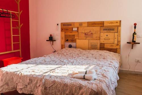 Ένα ή περισσότερα κρεβάτια σε δωμάτιο στο Casa Vacanze Callegari