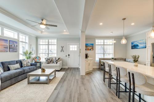 a living room with a couch and a table at Furnished Screened Porch Baypoint Resort Home! in Marblehead