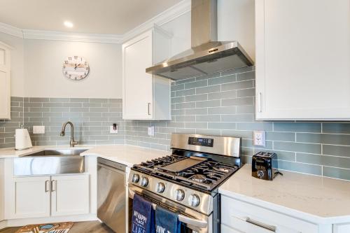 a kitchen with a stove and a sink at Furnished Screened Porch Baypoint Resort Home! in Marblehead