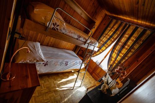 an overhead view of a bedroom with a bunk bed at Hotel Le Campagnol in Champoluc