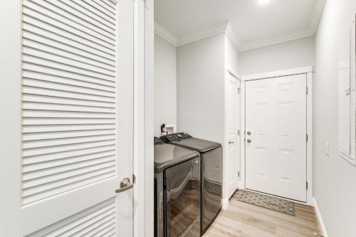 a hallway with white walls and a desk in a room at Furnished Screened Porch Baypoint Resort Home! in Marblehead