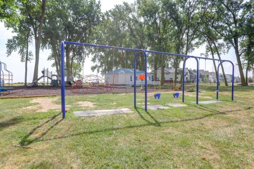 a batting cage in a park with a playground at Furnished Screened Porch Baypoint Resort Home! in Marblehead