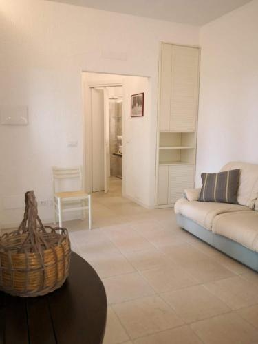 a living room with a couch and a table at Un'oasi tra i limoni in Naso