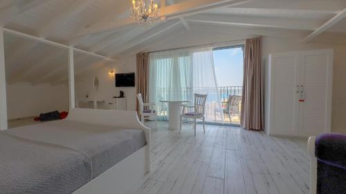 Postel nebo postele na pokoji v ubytování Cunda Nisa Otel