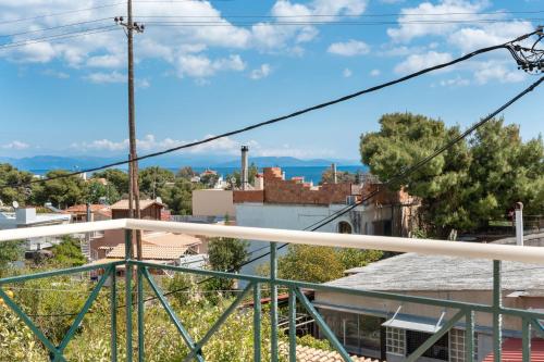 a view of the city from the balcony at Artemida Beach House in Artemida