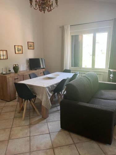a living room with a table and a couch at Il Belvedere in Casperia
