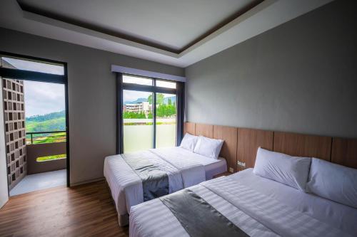 Ένα ή περισσότερα κρεβάτια σε δωμάτιο στο Elge Hotel and Villa Sarangan